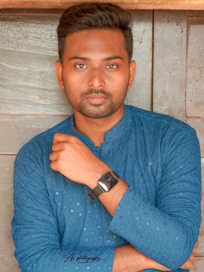 A medium shot of a model in an ethnic kurta, highlighting a watch accessory. This image is a great example of how to blend traditional wear with modern lifestyle elements.
