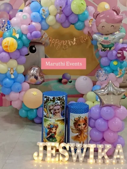A cute fairy-themed party with pastel balloon arrangements. The setup includes themed plinths, light-up letters for the name, and fairy character balloons.