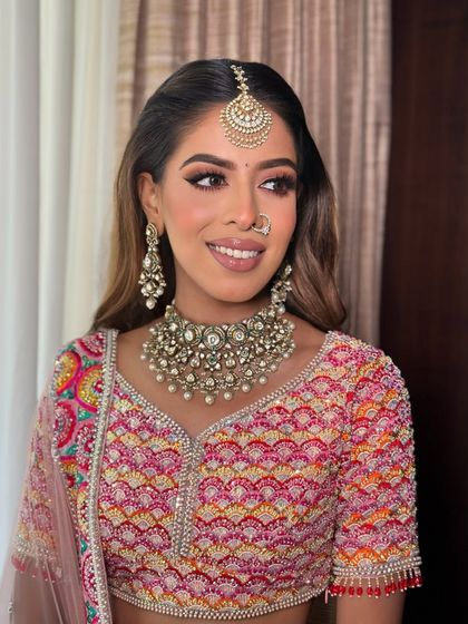 A happy bride is the most beautiful bride. Anjali is glowing with her sharp liner and warm, shimmery eyeshadow.