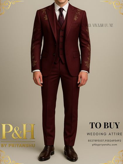 This angle showcases the impeccable tailoring and fit of the wine-colored three-piece suit.