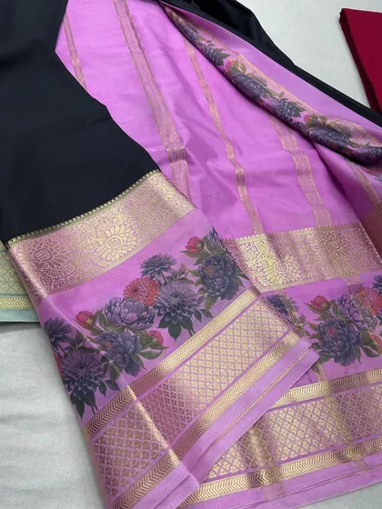 A chic black and lavender semi-Mysore crepe saree with a detailed floral border.