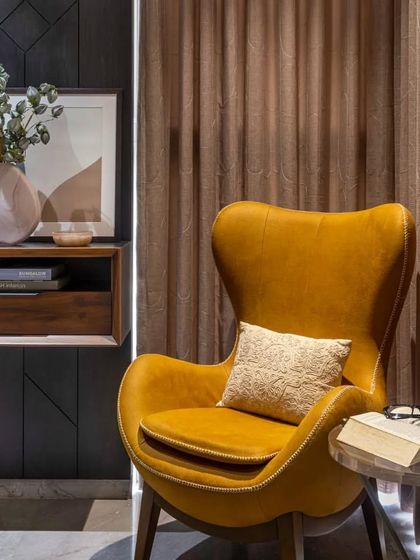 A perfect reading corner is a great addition to any bedroom. This cozy yellow wingback chair provides a comfortable spot to get lost in a good book.