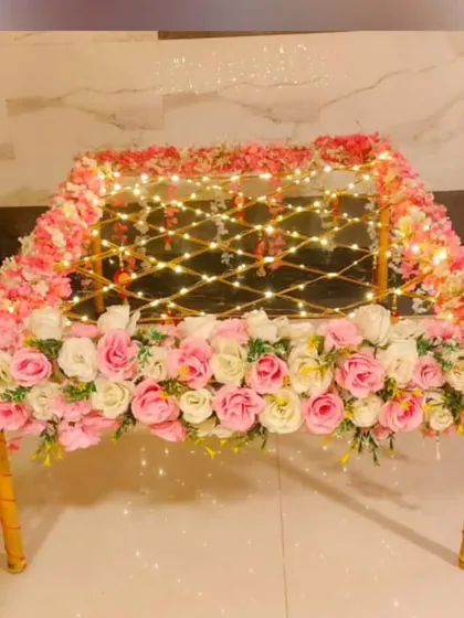 A beautifully decorated 'phoolon ki chaadar' for the bridal entry. This one is made with a canopy of pink and white roses and lit with fairy lights for a magical effect.