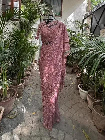 Draped and ready to go, this powder pink saree is a complete look for any celebration.