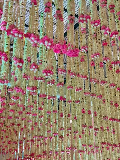 Different angles of the magnificent floral ceiling. These images showcase the density and artistry of the hanging blooms, which lend their magic to the entire venue.