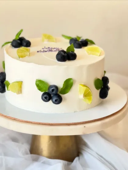 My most popular creation, the signature Italian Lemon & Blueberry cake. I offer many design variations, all featuring fresh blueberries, zesty lime, and smooth buttercream.