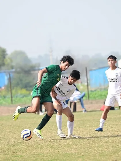 An action shot from the Dream Sports Championship semi-final, showing our player shielding the ball under pressure. This is the tenacity we build.
