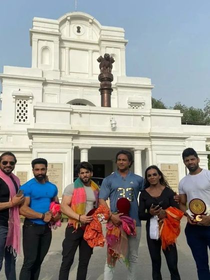 Standing with fellow athletes outside the Vidhaan Sabha after being honored. It is important to be recognized for the hard work we put into our sport.