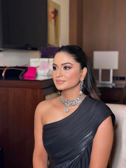 A sleek, wet-look ponytail for a cocktail night. This modern and high-fashion style is perfect for a one-shoulder gown.