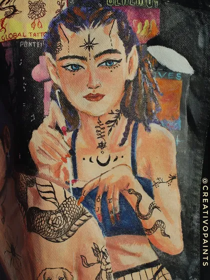 Another detail-oriented photo, this time focusing on the second figure in the portrait. Notice the fine lines used for the hair, the snake tattoo, and the symbols on her face.