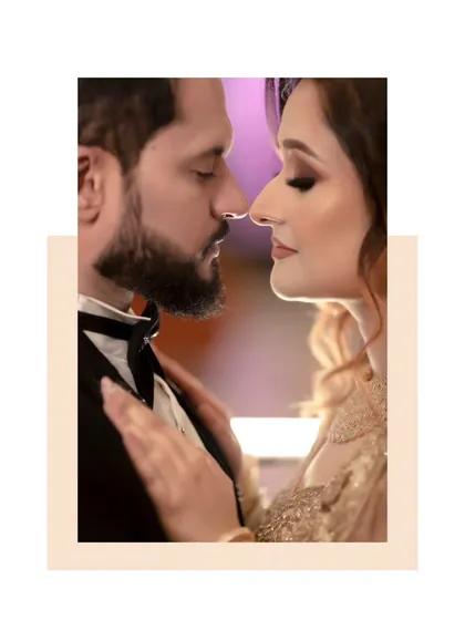 A beautifully framed close-up of the couple, their faces close, creating a romantic and timeless feel.