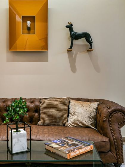 Waiting with flair. This penthouse lobby in Mumbai features a timeless leather Chesterfield sofa set against an artful backdrop. I designed this space to make waiting a delightful anticipation of the luxury that lies within.