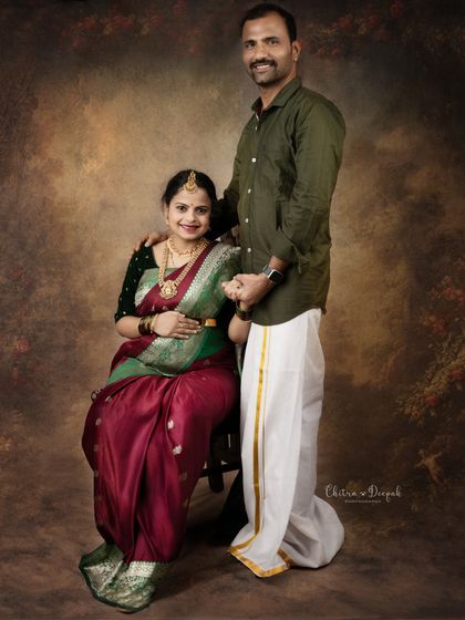 A full-length portrait of a couple in traditional South Indian outfits. Their loving pose creates a timeless and heartwarming image.