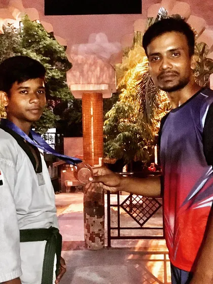 A senior student with his medal after the championship. His focus and determination are an inspiration to the younger members of our academy.