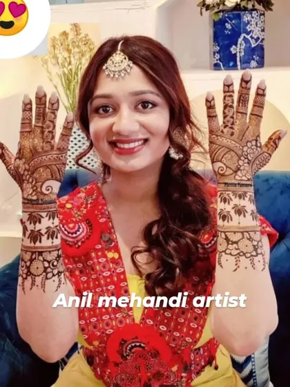 A beautiful and happy client showing her matching lotus-themed mehandi. The smile on her face is a testament to the quality of my work.