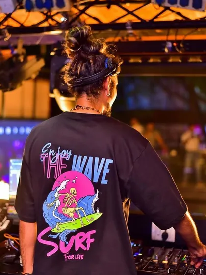 A duplicate of image 68, capturing the vibe from behind the decks as I look out at the party.