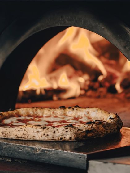 A Margherita basking in the glow of our wood-fired oven. It's a beautiful sight.
