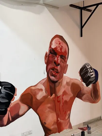 The finished mural of the legendary Nate Diaz, a fighter known for his grit and toughness. This artwork inspires everyone who trains on our mats.