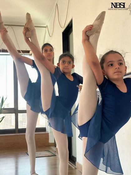 Young dancers practicing their extensions. The focus and determination in their eyes is incredible to see.
