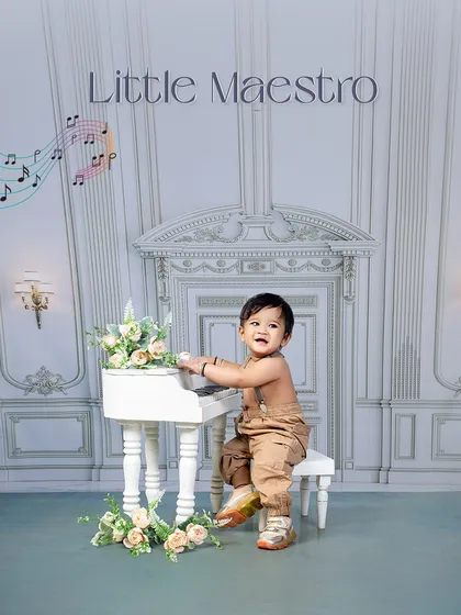 The keys to cuteness are unlocked by our little maestro. This simple, elegant setup with a mini piano creates a timeless and adorable portrait.
