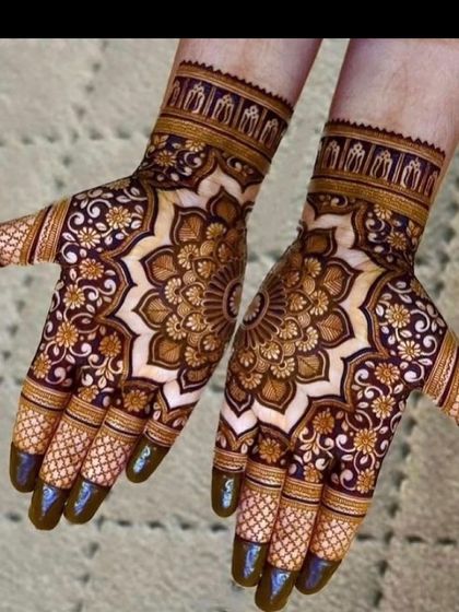 The stained result of a heavy mandala design. The dark maroon color shows the quality of my natural henna paste. Notice how the central mandala is surrounded by delicate floral work.