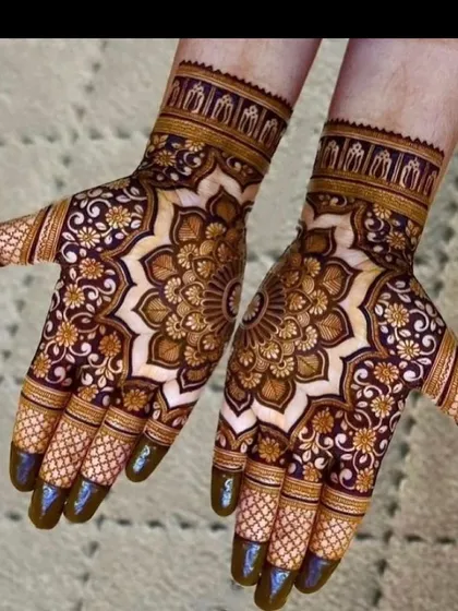 The stained result of a heavy mandala design. The dark maroon color shows the quality of my natural henna paste. Notice how the central mandala is surrounded by delicate floral work.