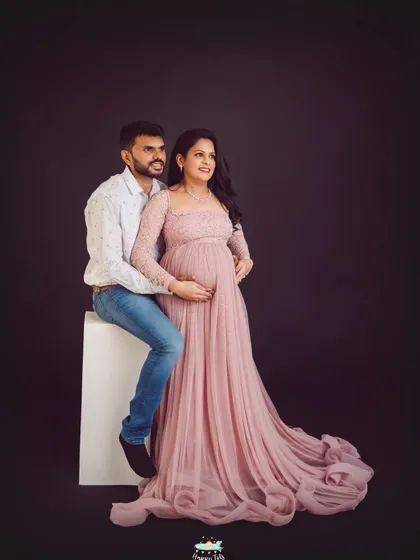 A slightly different angle of this classic couple's pose. It offers a wonderful view of the gown's train and the couple's serene connection.
