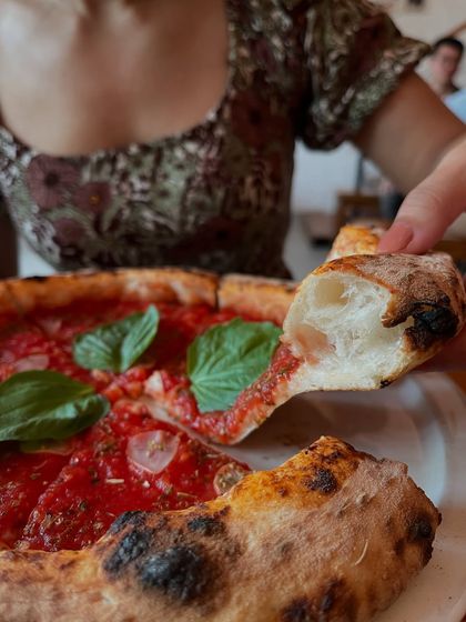 Another look at a slice of our Marinara. The perfect fold.