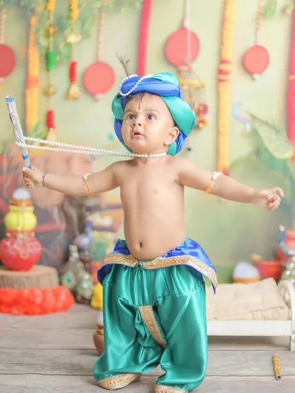 Arms wide open! This playful pose shows the joyful energy of a toddler during his themed photoshoot.