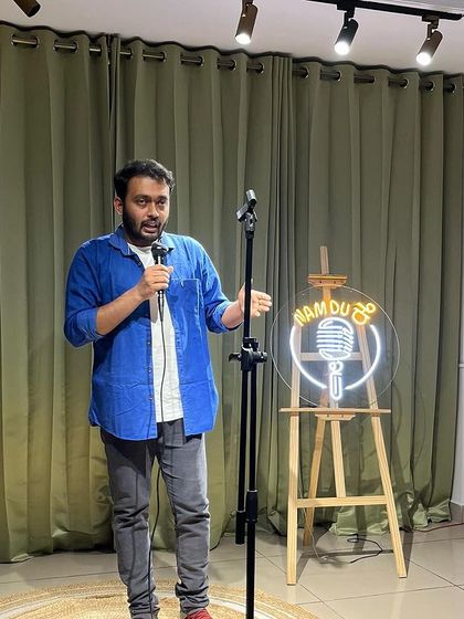 A comedian delivering his set at our popular Kannada stand-up event.
