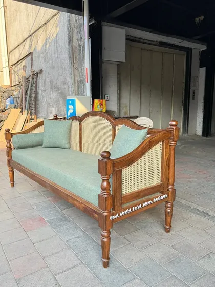 Another angle of the teak and cane daybed, ready for delivery.