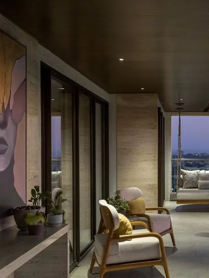 A very large vertical portrait painting installed on a balcony in Mumbai. Its scale is perfect for spaces with high ceilings.