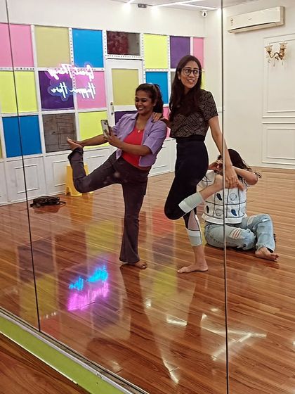 It's not always serious. Here are a few of us having a laugh and striking a pose after class. Finding joy in the practice is just as important as the discipline.