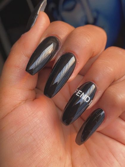 For the fashion lovers, I can even add your favorite brand logos. This client wanted a sleek, minimalist look with glossy black nails and a crisp white Fendi logo on an accent nail.