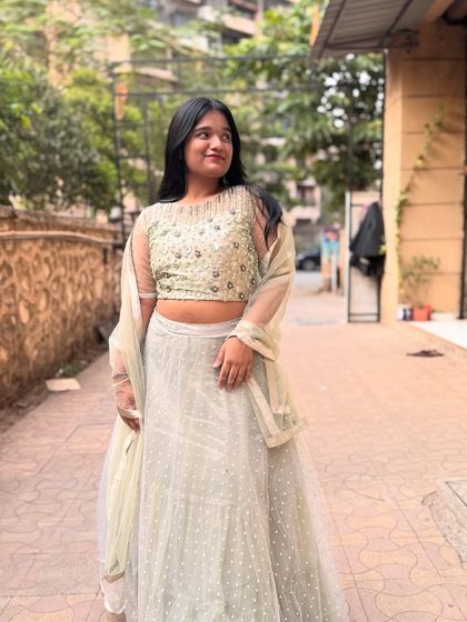This light pista green lehenga with a pearl-studded blouse is a subtle and elegant choice for a Mehendi or engagement party.