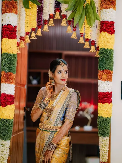 A picture-perfect family celebrating their housewarming. I had the pleasure of dressing my client Archana in a hand-worked blouse, her husband in a custom shirt, and their son in a charming Kalamkari kurta.