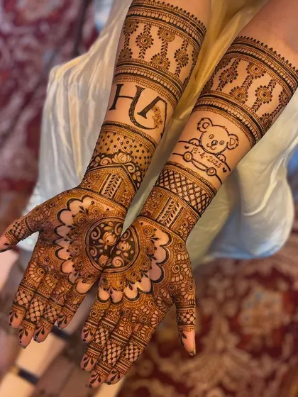 Your mehendi should tell your story. Here, I included the couple's initials and a special teddy bear design to celebrate their journey. I can customize your mehendi with names, dates, or any symbol that's meaningful to you.