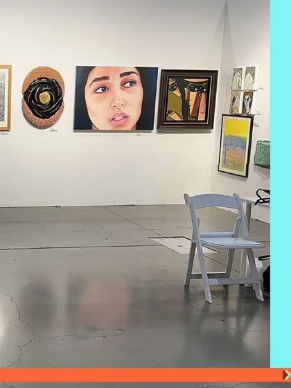 Another view from a previous Seattle Art Fair, showcasing a diverse collection of paintings.