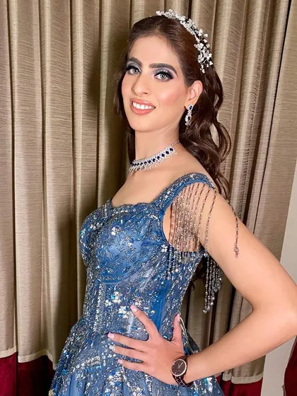 Cocktail nights are for making a statement. Here, we created a bold and glamorous look with a dramatic smokey eye and sculpted features, perfect for an evening of celebration and dancing.