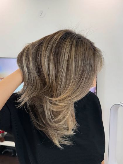 This look is soft, buttery, and natural with depth. I created these beautiful blonde tones to be bright but still look completely natural and sophisticated.