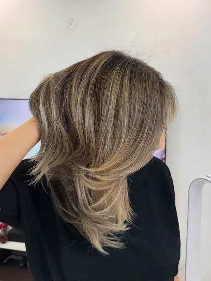 This look is soft, buttery, and natural with depth. I created these beautiful blonde tones to be bright but still look completely natural and sophisticated.