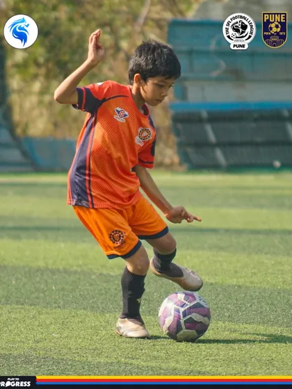 A moment of focus. A young player in Pune prepares to make his next move with the ball at his feet.