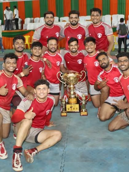 Our winning team posing with the trophy after a successful tournament.