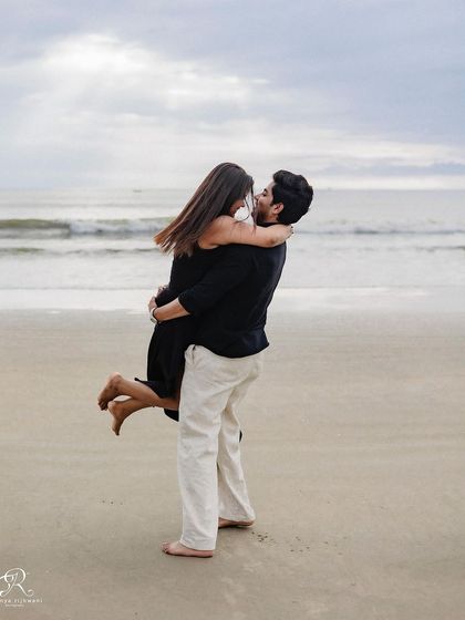 A playful lift on the beach against the backdrop of the sea. These fun, interactive moments make for the best memories and show the dynamic of a couple's relationship during their pre-wedding shoot in Goa.