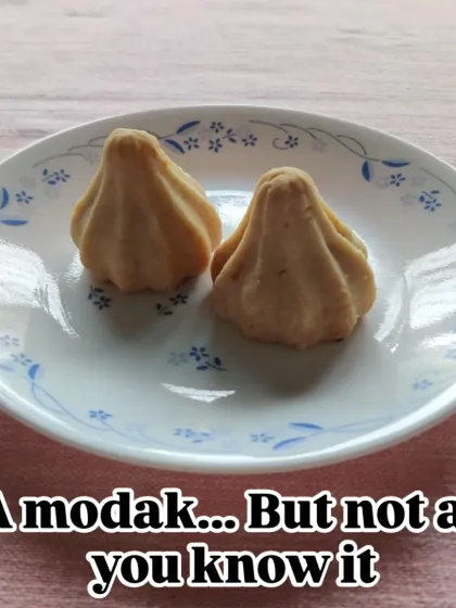 This might look like a modak, but it's not as you know it. The outer shell is a baked, buttery pie crust, offering a delightful textural contrast to the soft, sweet filling inside.