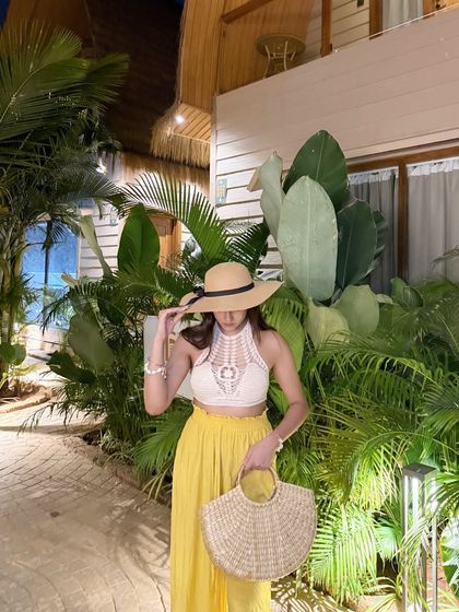 Adjusting my hat, a classic vacation pose.