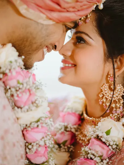 In the quiet moments, love speaks the loudest. This intimate close-up captures the pure joy and connection between a bride and groom, where a simple smile and gentle touch tell the entire story. I focus on these unscripted feelings to make your wedding album truly personal.