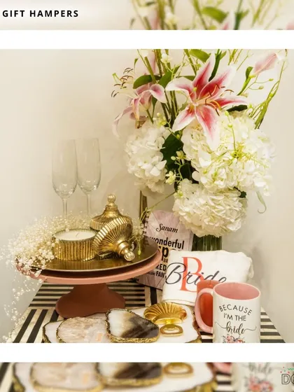 I design these bridal hampers to make the bride-to-be feel truly special. This set includes a "Because I'm the Bride" mug, a personalized t-shirt, champagne flutes, and other pampering items, all beautifully arranged on a decorative stand.