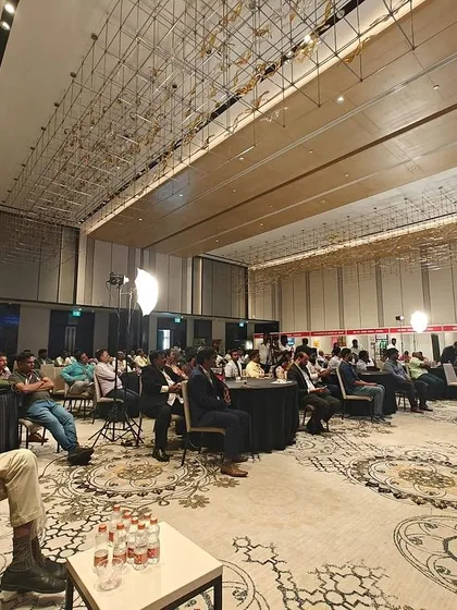 A wide shot of the audience at the IBN 20 Business Conference in Chennai. This image provides social proof of our influence, showing our leaders sharing insights with a room full of industry pioneers and professionals.