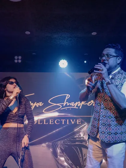 Performing with my mentor during a Tanya Shanker Collective show. This photo shows the collaboration and support that goes into my original music project.